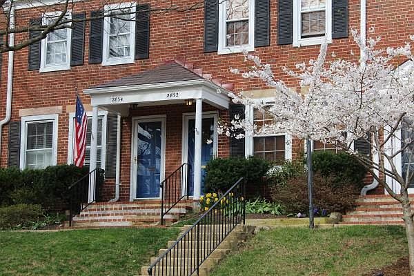 Front of townhouse in Spring time. View from parking lot.