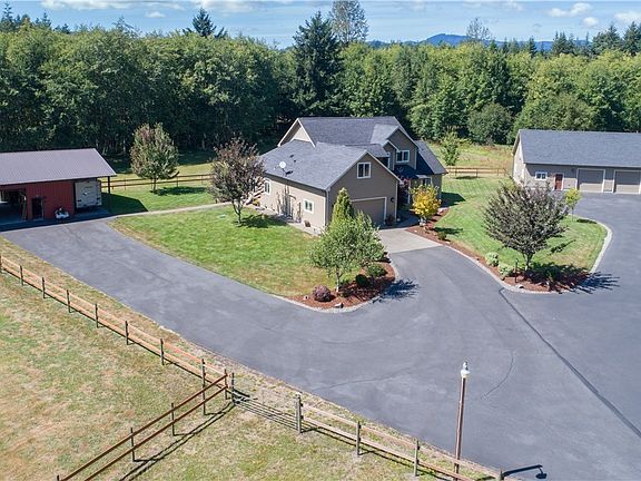 Great shot of the home, barn w/RV covered parking and power & shop! 2 pasture areas on the left