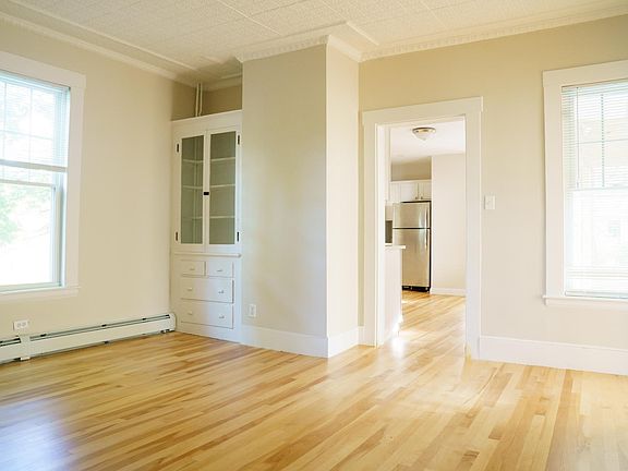 Living room with a built in cabinet.