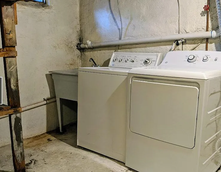 Shared laundry and storage are in basement