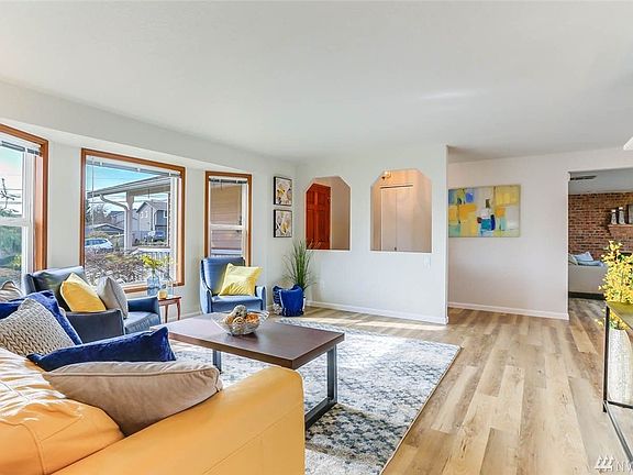 Living area has sight-lines to entry way and family room.