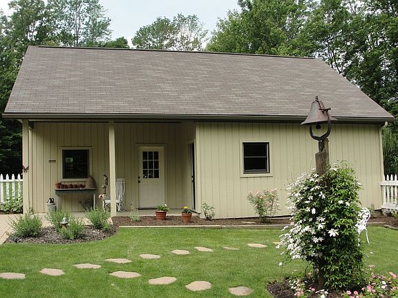 Two car detached garage with covered porch