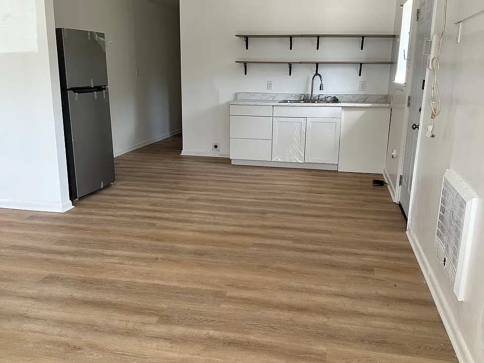 New kitchen cabinets, comes with kitchen appliances (stove and refrigerator). This home also has washer and dryer hooks.