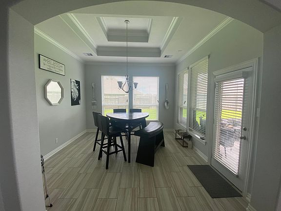 dining room with tray ceilings