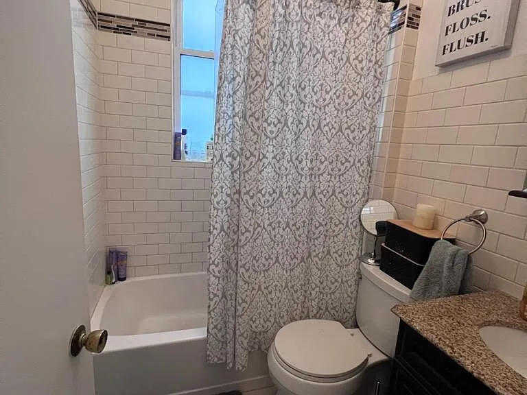 Bathroom, showing tub and window