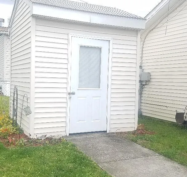 Utility shed in back for your mower and other storage