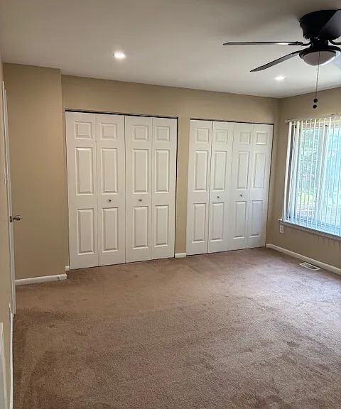 Master bedroom with large ceiling fan