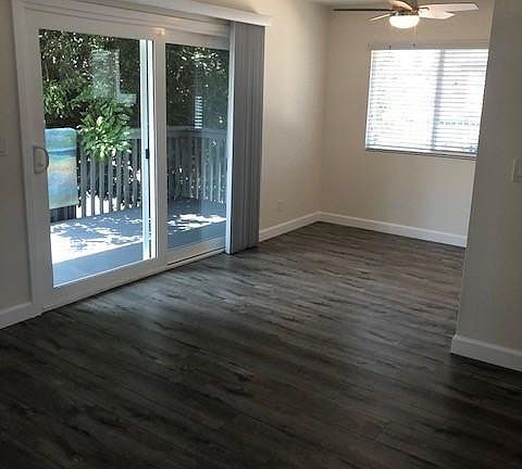 Living Room looking into Kitchenette with ceiling fan