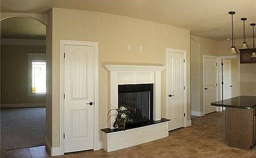 Dining room see-through fireplace looking into living room and Master on right.