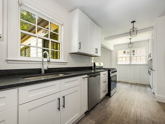 Brand new kitchen includes new cabinets and appliances.