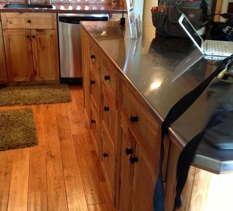 kitchen with stainless steel island with storage