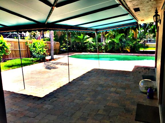 a BROWN PATIO TO POOL