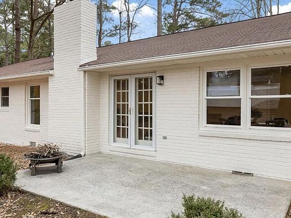 Fenced in backyard with patio.