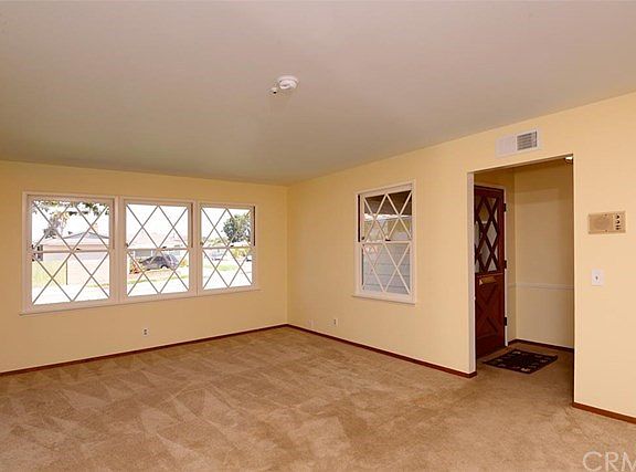 1950s constuction featured attractive diamond shaped double hung sash windows. This view of the spac