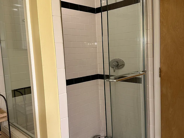 Spacious shower in bathroom.