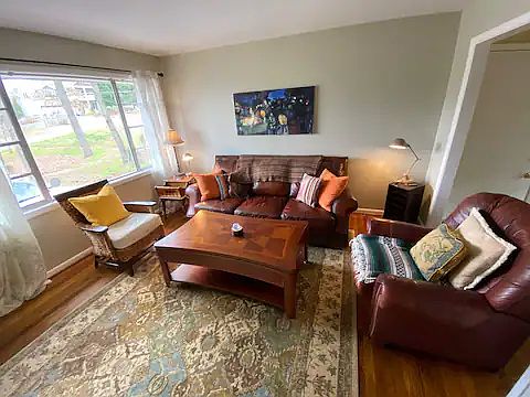 Living room with open floor plan into dining/kitchen area.