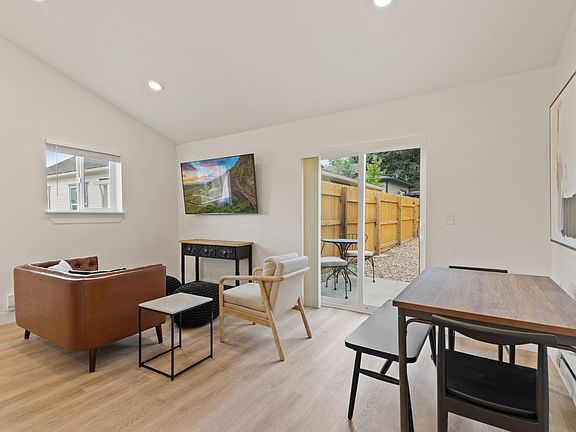 dining area and living area. view of backyard patio and private fenced backyard.
