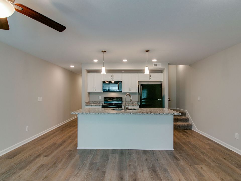 Great room open to kitchen. LVP Flooring on Main level Stairs leads to 3 Bedrooms and Full Baths