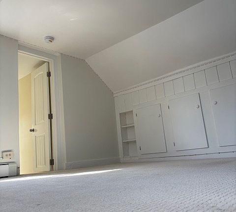 Kids bedroom wall to wall carpet but in wall storage