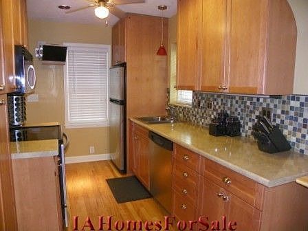 Beautifully updated Kitchen w/ stainless steel Amana appliances and lots of cabinet space.