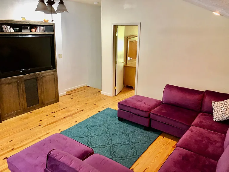 Family room for movie night, or sprawl out and enjoy your favorite programs - Roku connected.