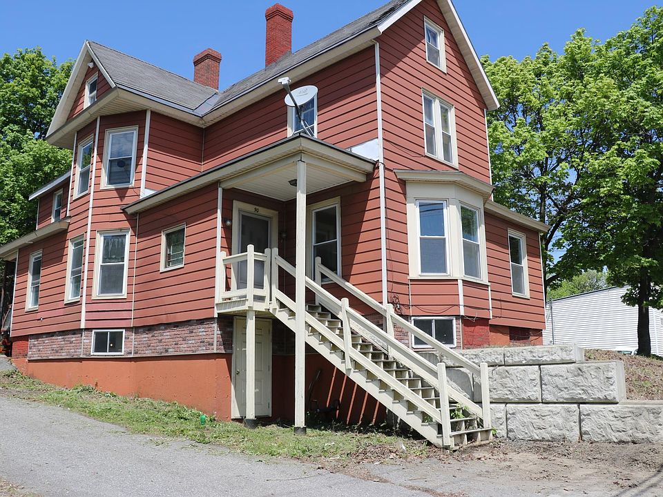Front of house. Ground floor entry at the back left corner.
