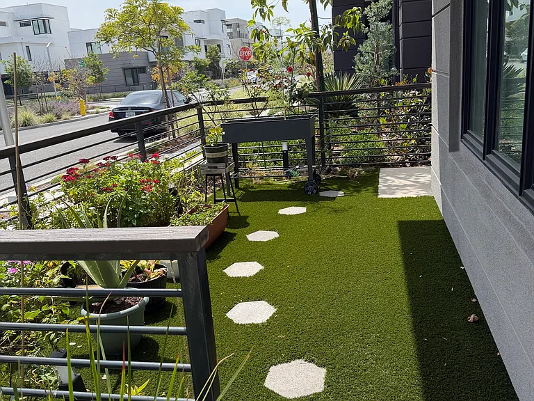 Front Yard with artificial lawn and drip irrigation for plants