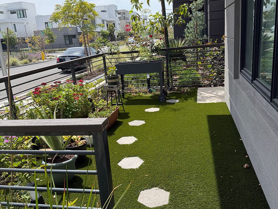 Front Yard with artificial lawn and drip irrigation for plants