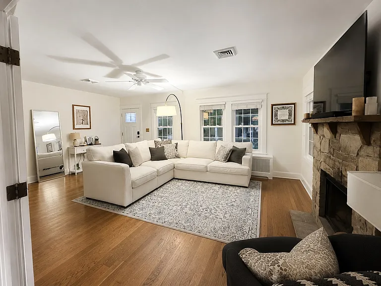 Living room with wood burning fire place