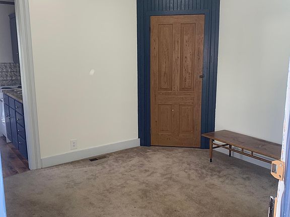 Living room with corner linen closet