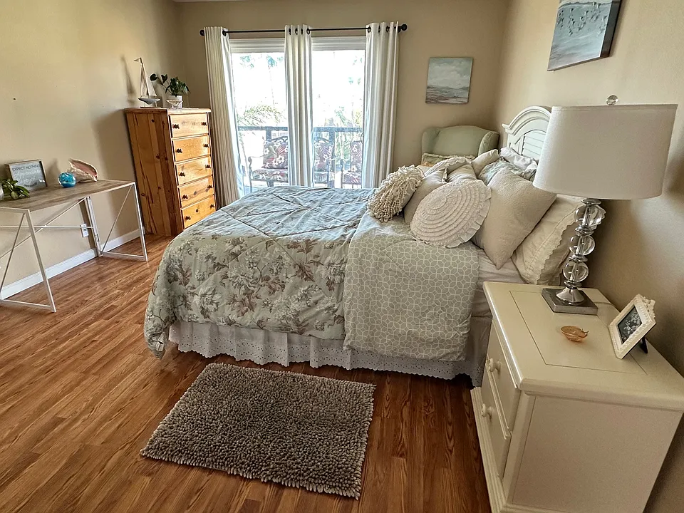 Spacious room with queen bed and computer desk