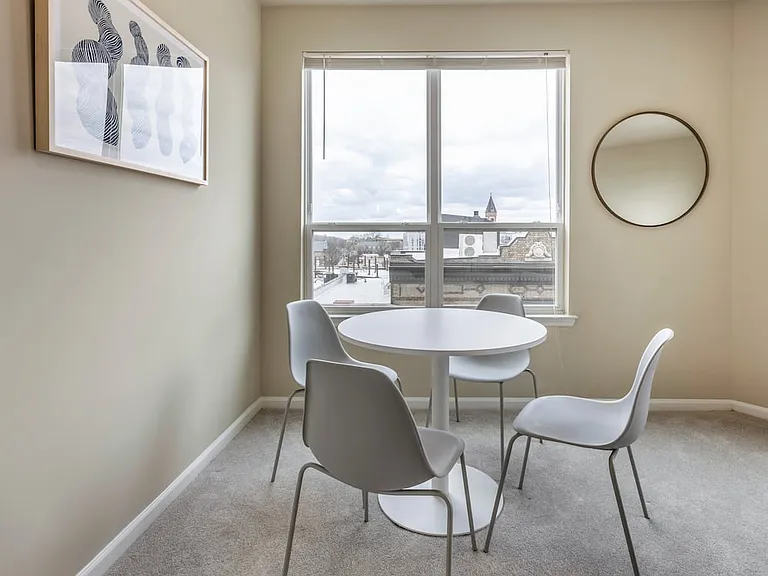 Furnished+ apartment homes include a dining set (Representative Image exact items and style of furnishings may vary)