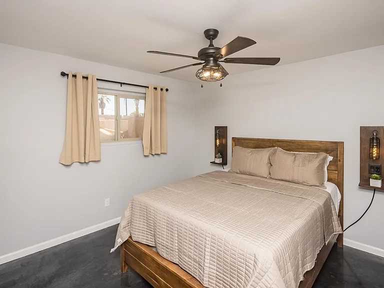 Custom wall-mounted lighting and warm wood finishes for added character.