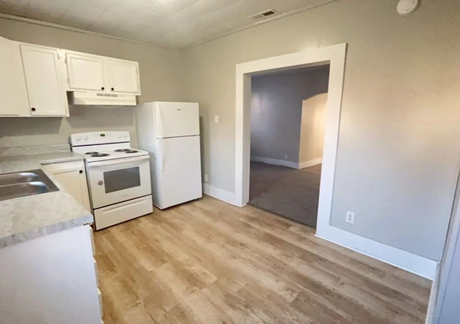1506 W 10th St - Charming 4BR Home with Sunlit Rooms & Spacious Living Areas — Photo 1