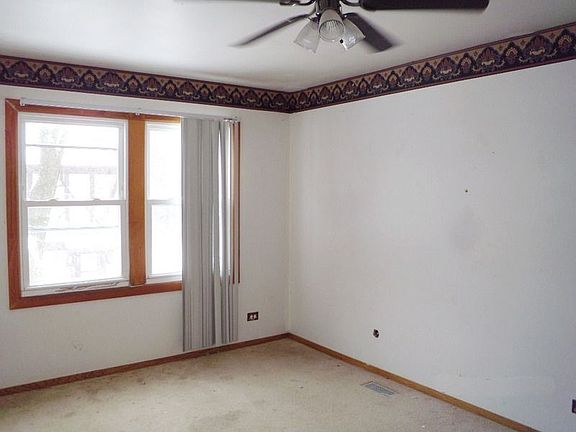 Master Bedroom with Ceiling Fan and Carpet