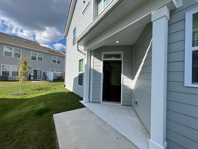 Front porch has plenty of room for seasonal decor.