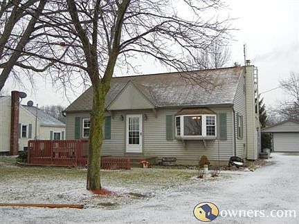 Home features a gravel driveway with turnaround & 2-car garage.