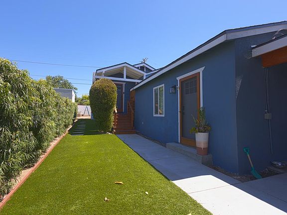 View of detached front multi-purpose room and staircase to main house.
