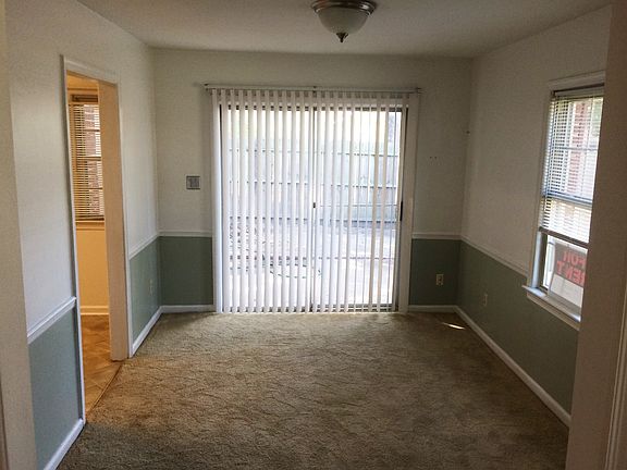 off-kitchen dining room with balcony to fenced-in patio
