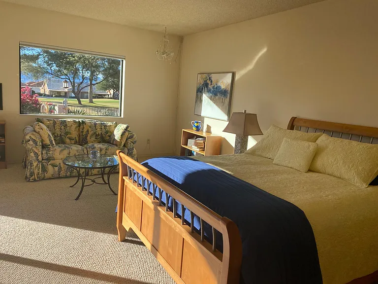 Beautiful picture window overlooking the golf course and mountains. Master bedroom, Queen.