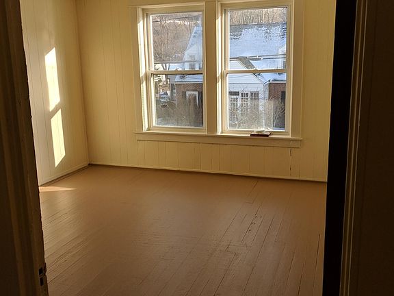 One of two Bedrooms. Both have two windows, hardwood floor, and closet space.