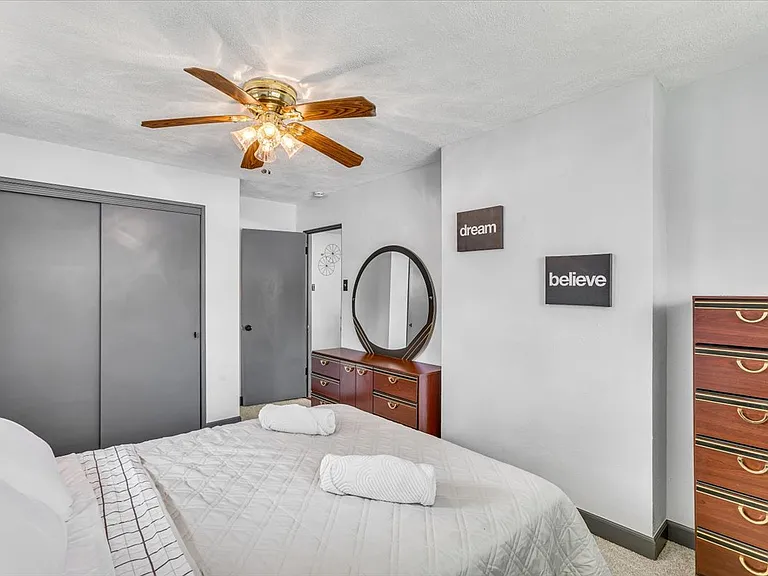 Bedroom 2: Queen Bed and Dresser