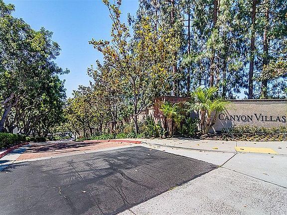 Gated Tree Lined entrance to Canyon Villas