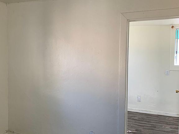 View of living room and partial view of bedroom.