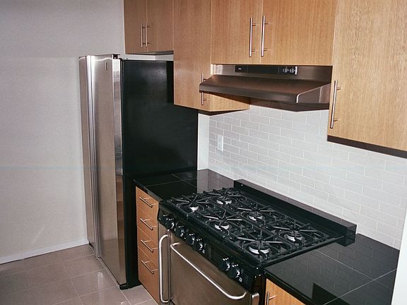 Gourmet kitchen with stainless appliances.