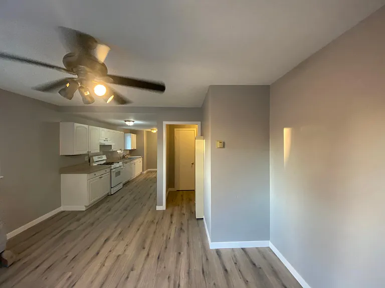 Looking towards the kitchen from the dining area, with hallway to the right.