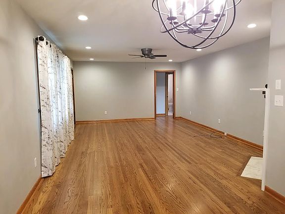 you are standing in the dining room and looking at the family room, the front door is on the far left and the fire place is on the right