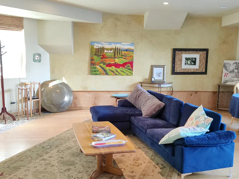 Huge sunny living room, West and north light. Heated bamboo and carpeted floors throughout.