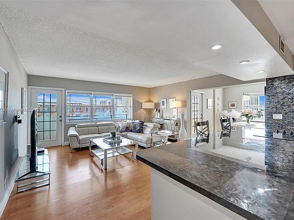 The lobby of the building features modern furniture and lots of natural light.  Such space are designed to create a welcoming and impressive entrance.