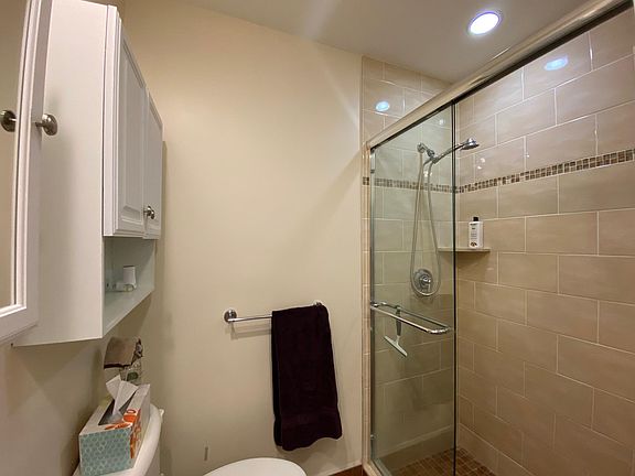 New W/D combo in the bathroom on the right upon entering. Beautiful Large walk in shower